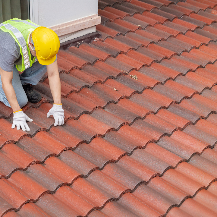 home inspector performing roof inspection in port st lucie florida