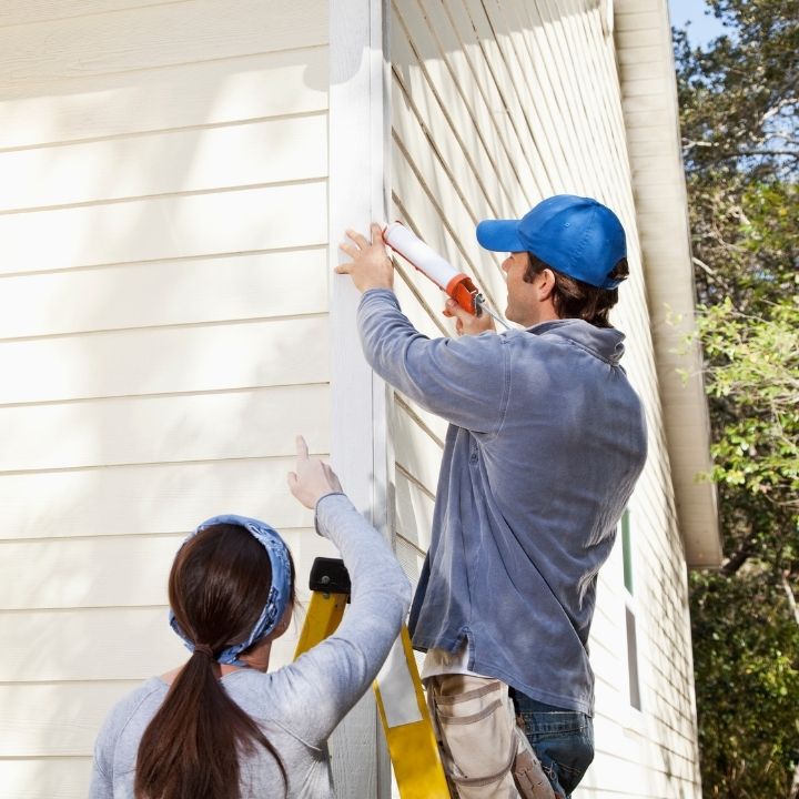 couple maintaining their home after a pre-purchase home inspection florida